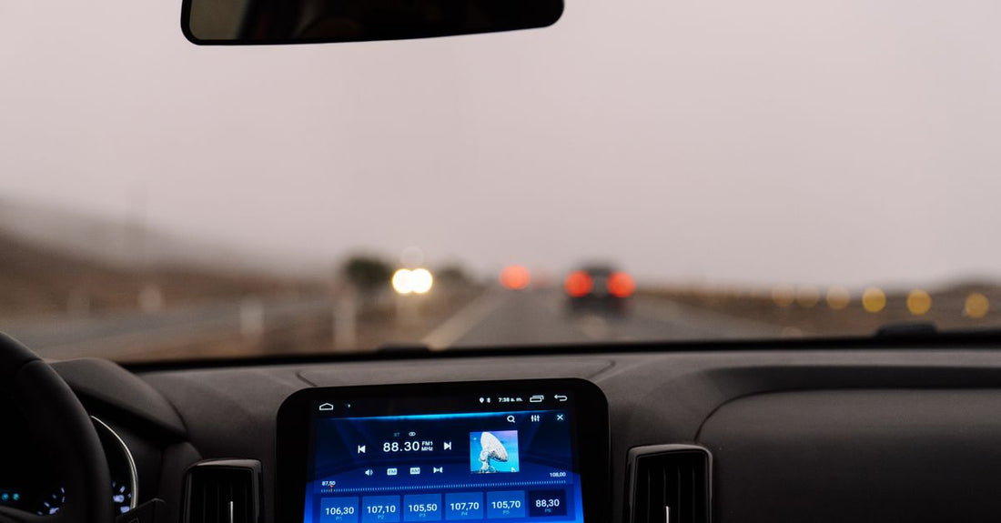 Interior view of a car dashboard on an open road during the day. Perfect for travel-themed projects.