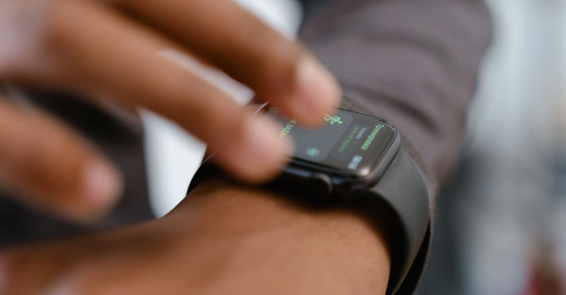 A detailed image showing a person interacting with a smartwatch, highlighting fitness tracking capabilities.